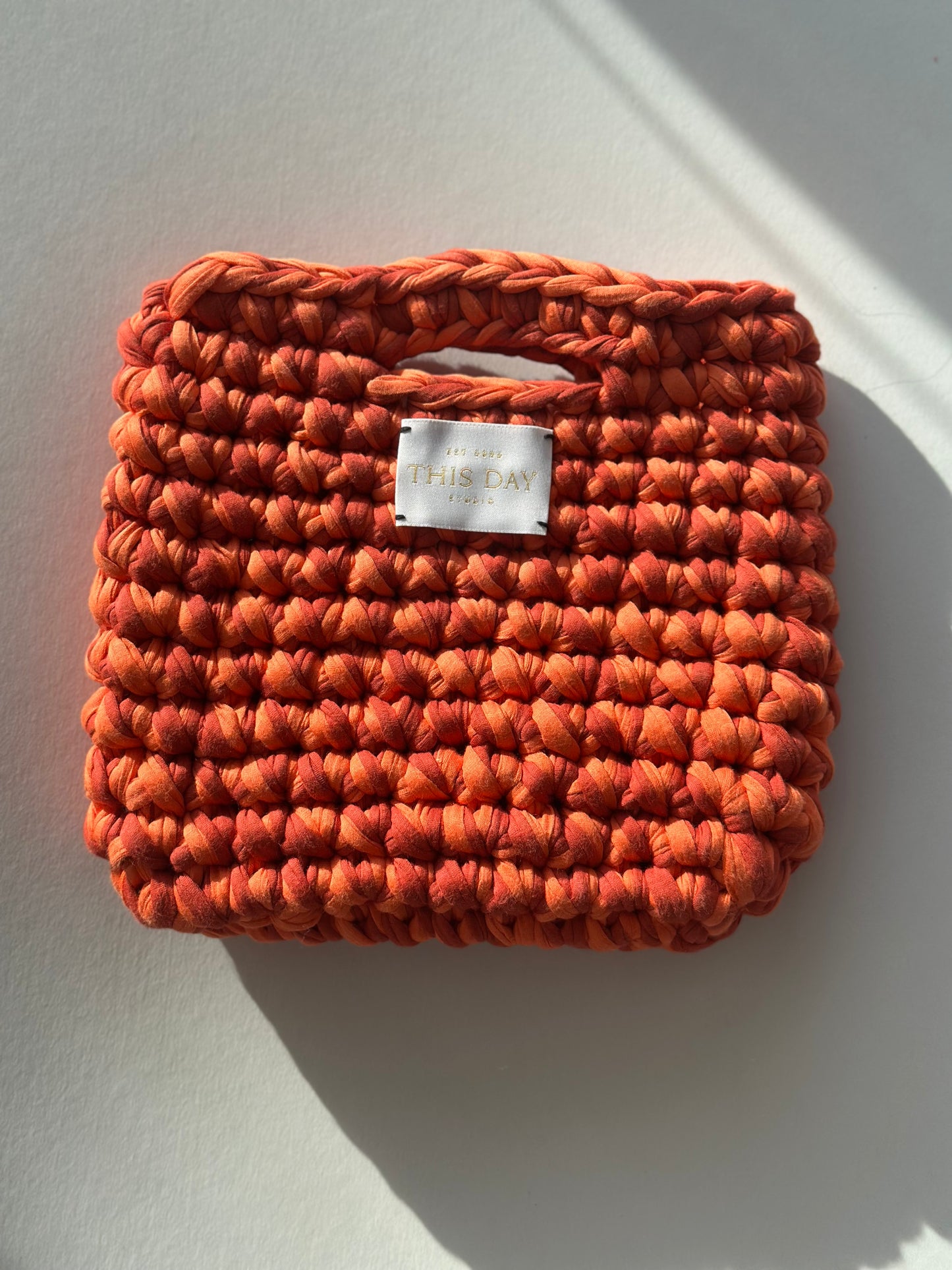Handmade Crochet Bag - Capture the warmth of golden hour with the Sunset Glow Crochet Bag, a handcrafted artisan piece bursting with the rich, fiery hues of a setting sun.