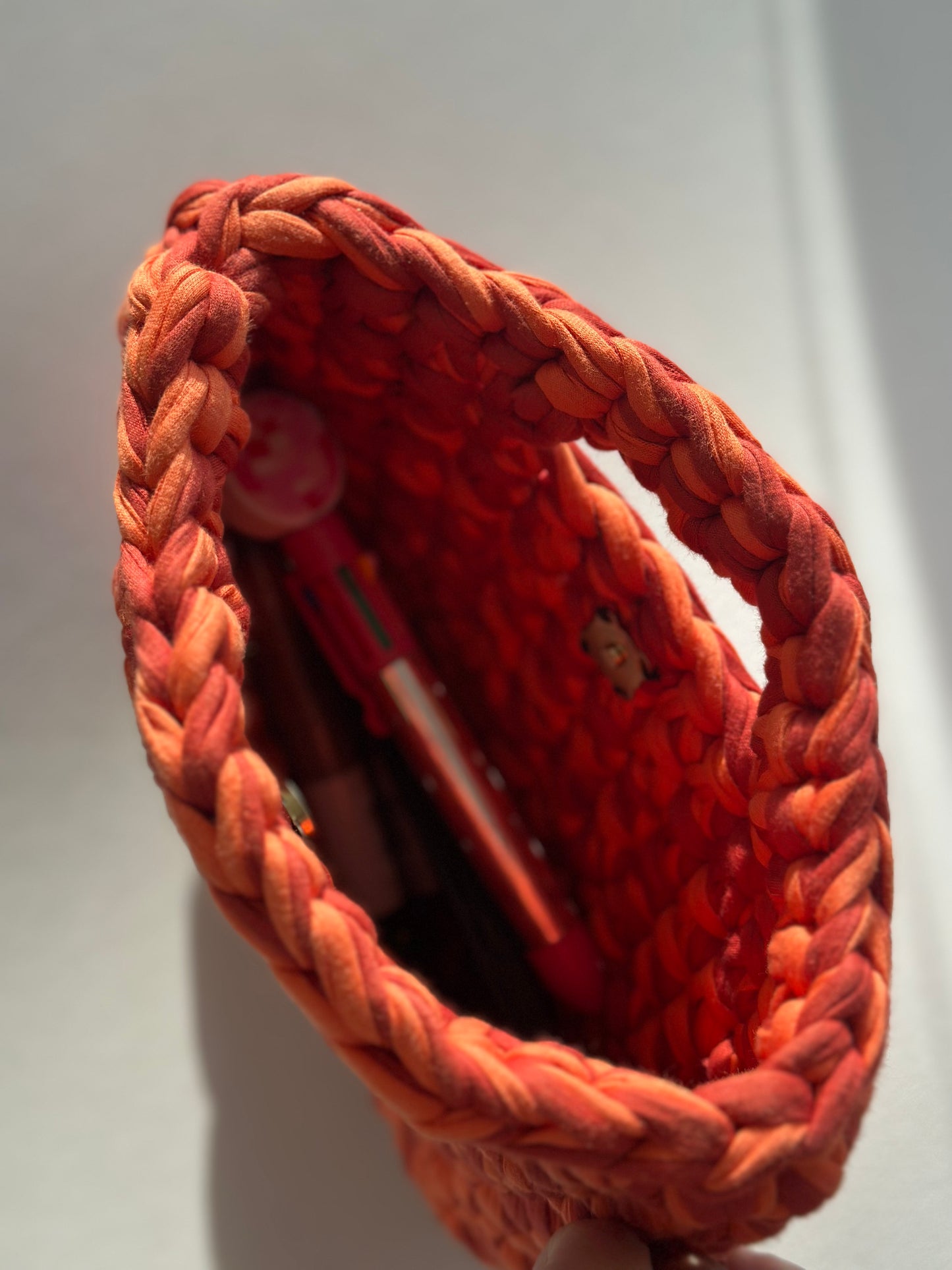 Handmade Crochet Bag - Capture the warmth of golden hour with the Sunset Glow Crochet Bag, a handcrafted artisan piece bursting with the rich, fiery hues of a setting sun.